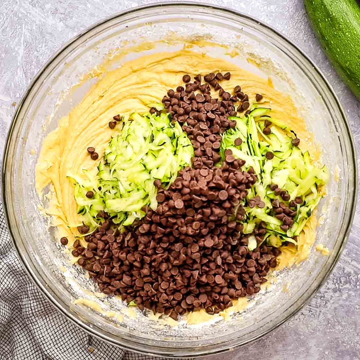 zucchini and chocolate chips added to the cake batter