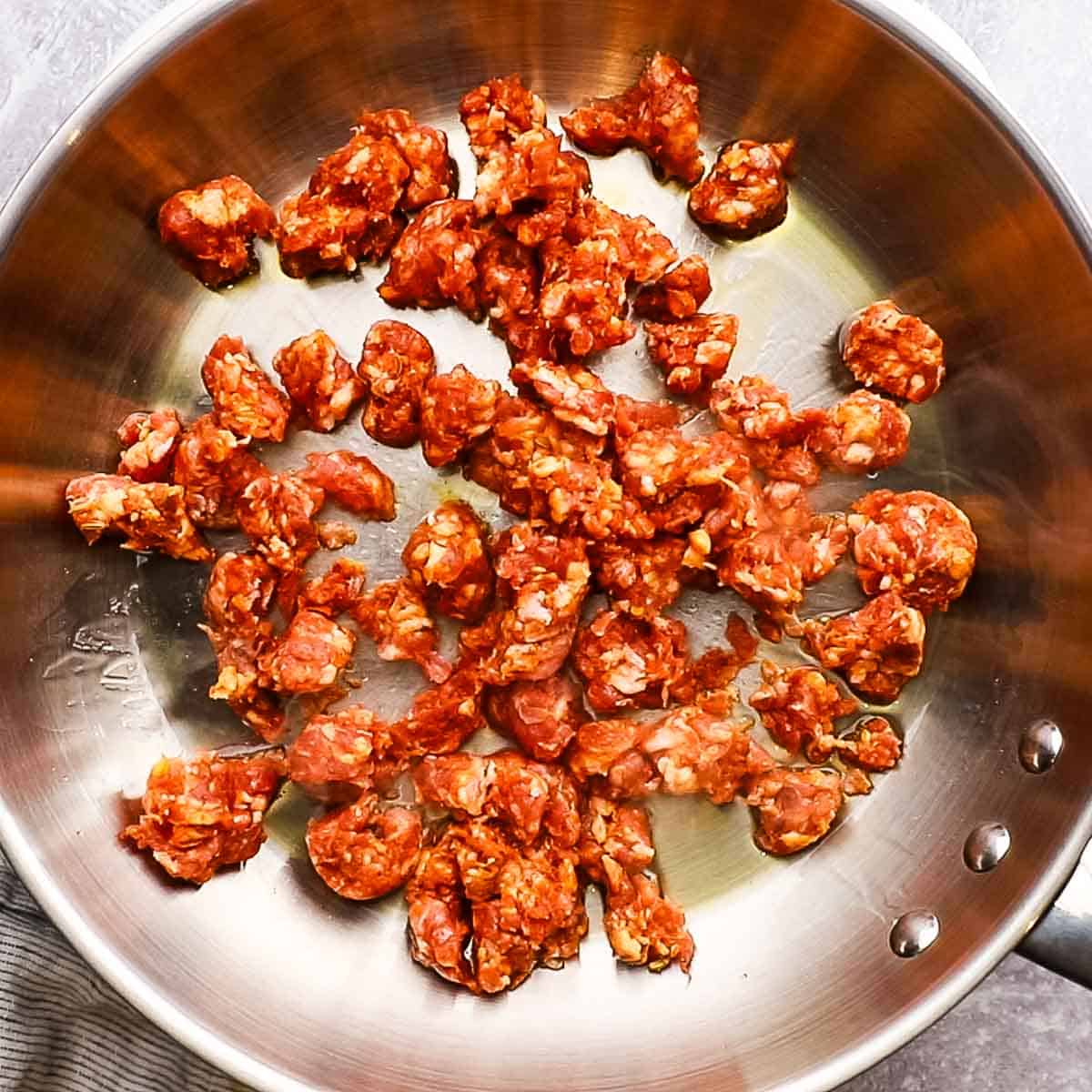 sausage added to a pan