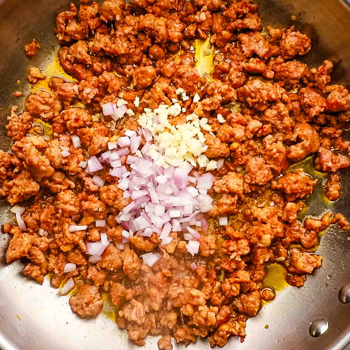 minced shallot and garlic added to the sausage