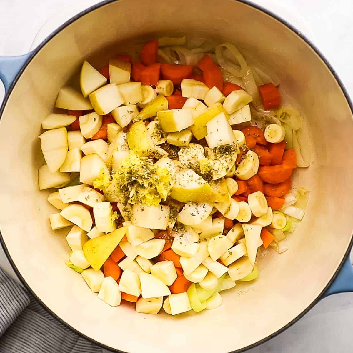veggies added to the pot with seasonings
