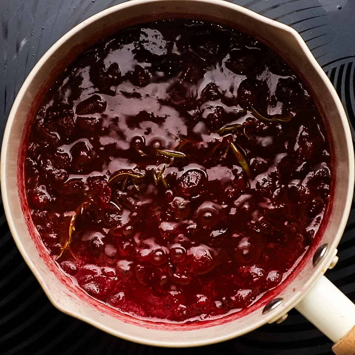 cranberry glaze cooking on the stove