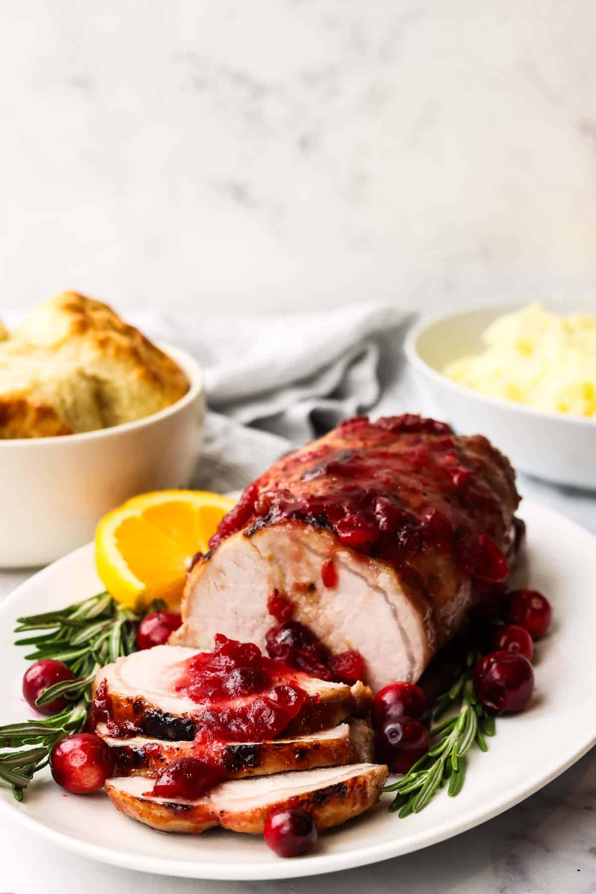 cranberry glazed pork loin served on a platter