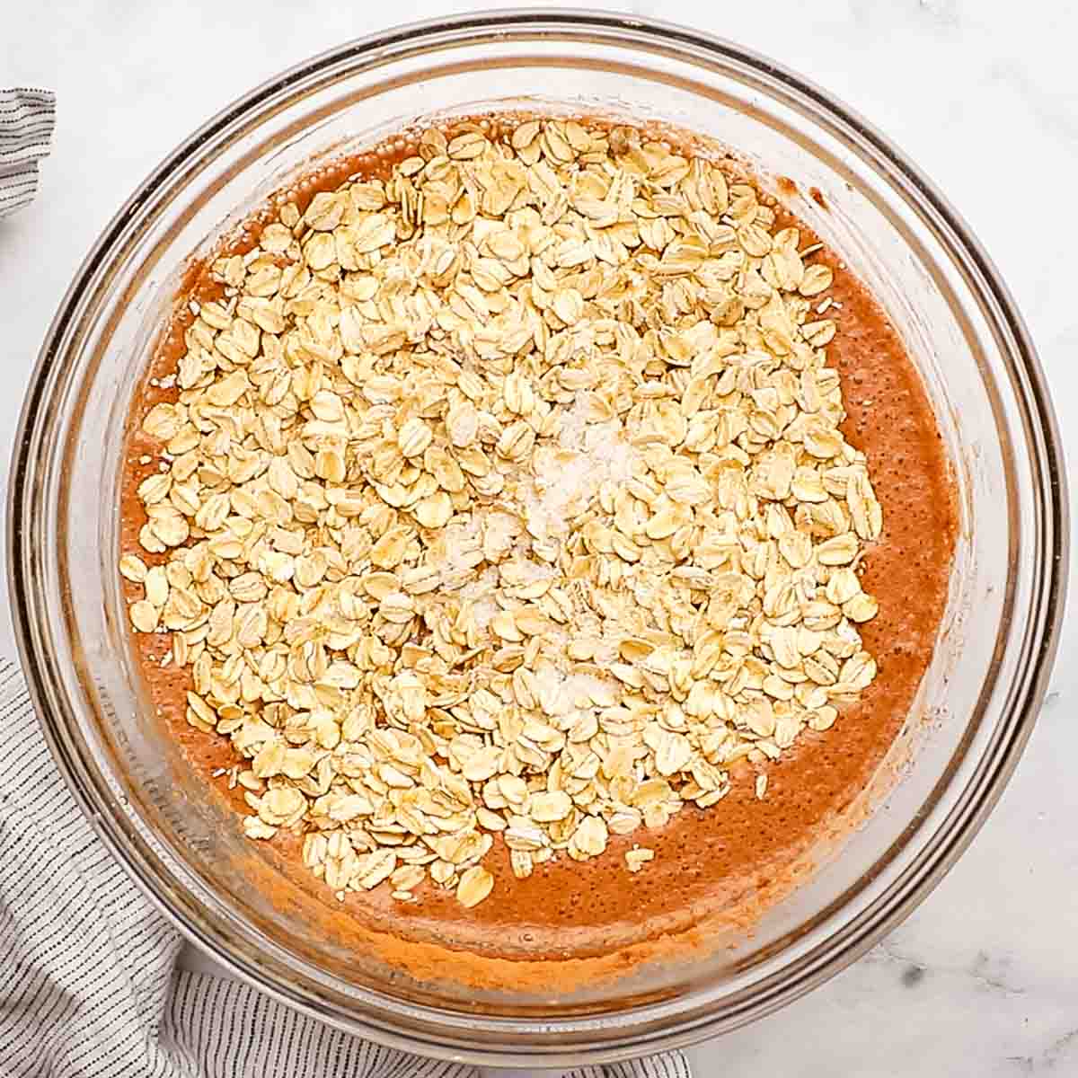 oats added to the liquid in the bowl