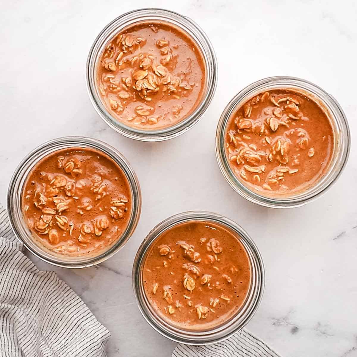 overnight oats mixture divided in mason jars