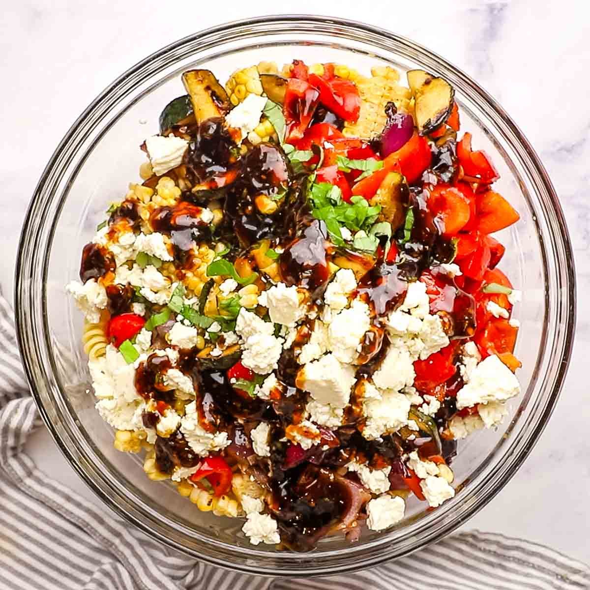 all the ingredients for the balsamic pasta salad added to a bowl