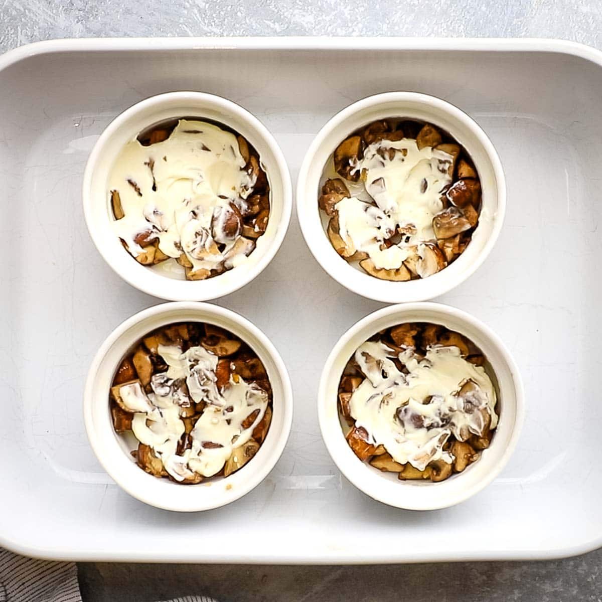 crème fraîche added to the mushrooms in the ramekins