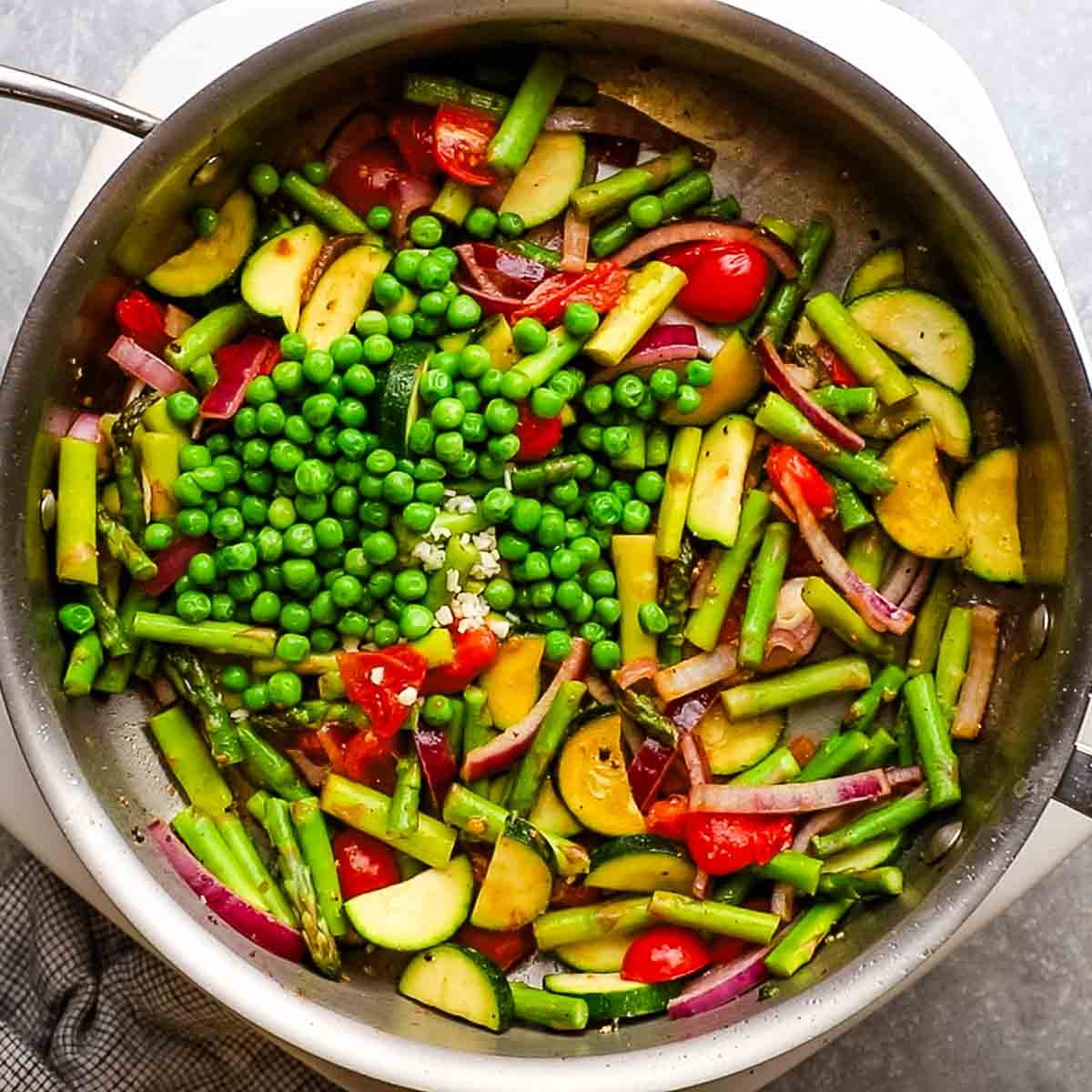 peas added to the skillet with the veggies