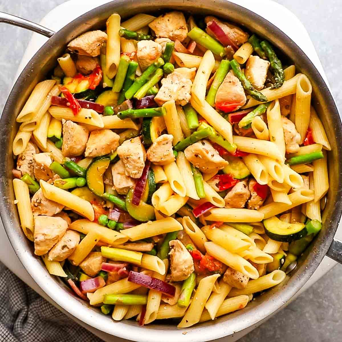 veggies, chicken, and pasta stirred together