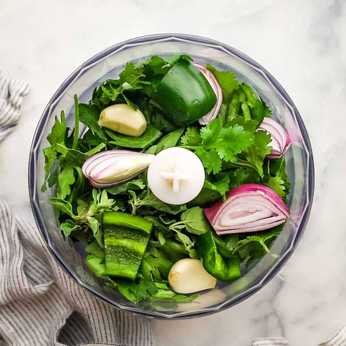 ingredients for chimichurri in a food processor