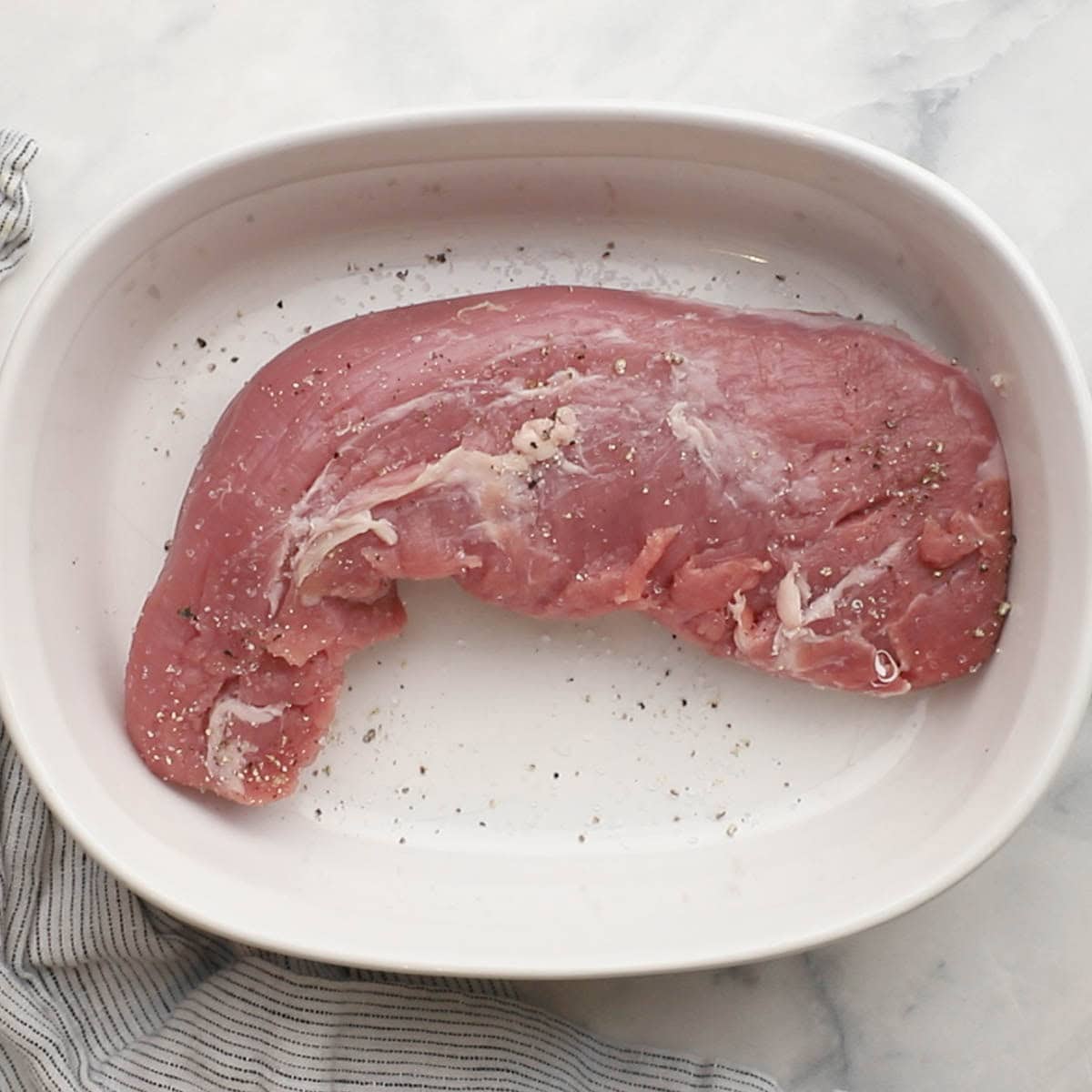 pork tenderloin seasoned with salt and black pepper