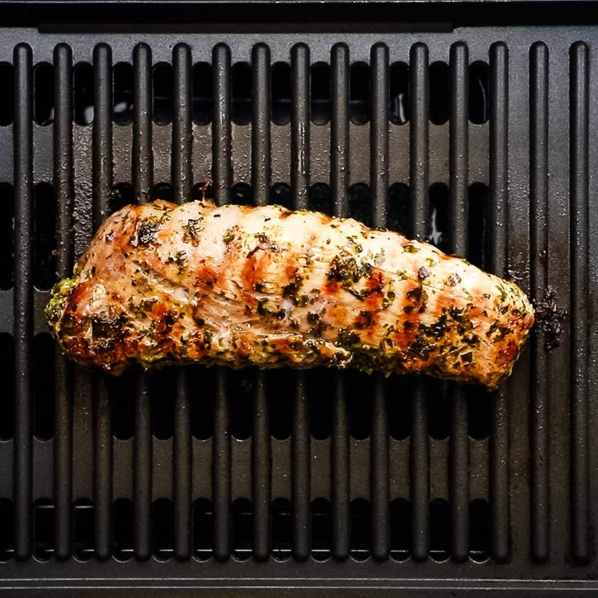 pork tenderloin on the grill with grill marks