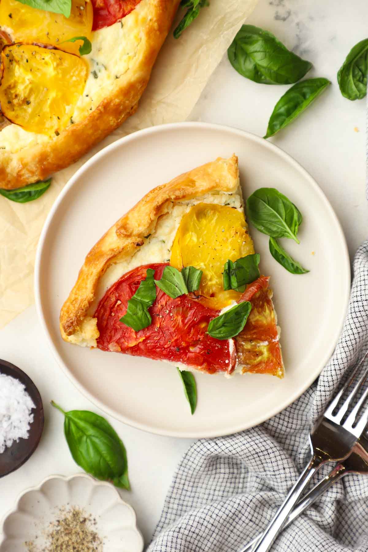 a slice of heirloom tomato tart on a plate