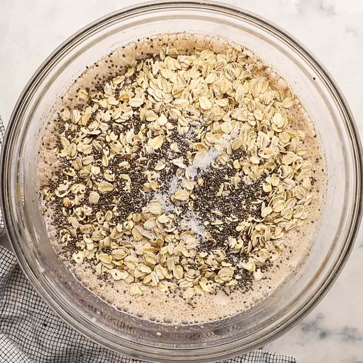 oats, chia seeds, and salt added to the bowl