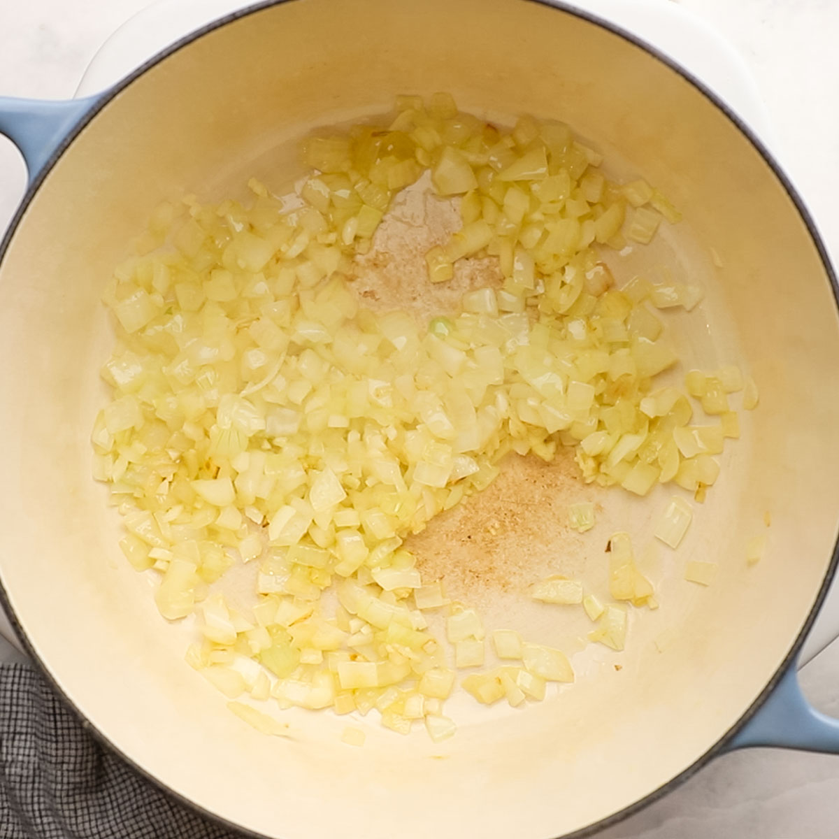 onion and garlic cooking in a large pot