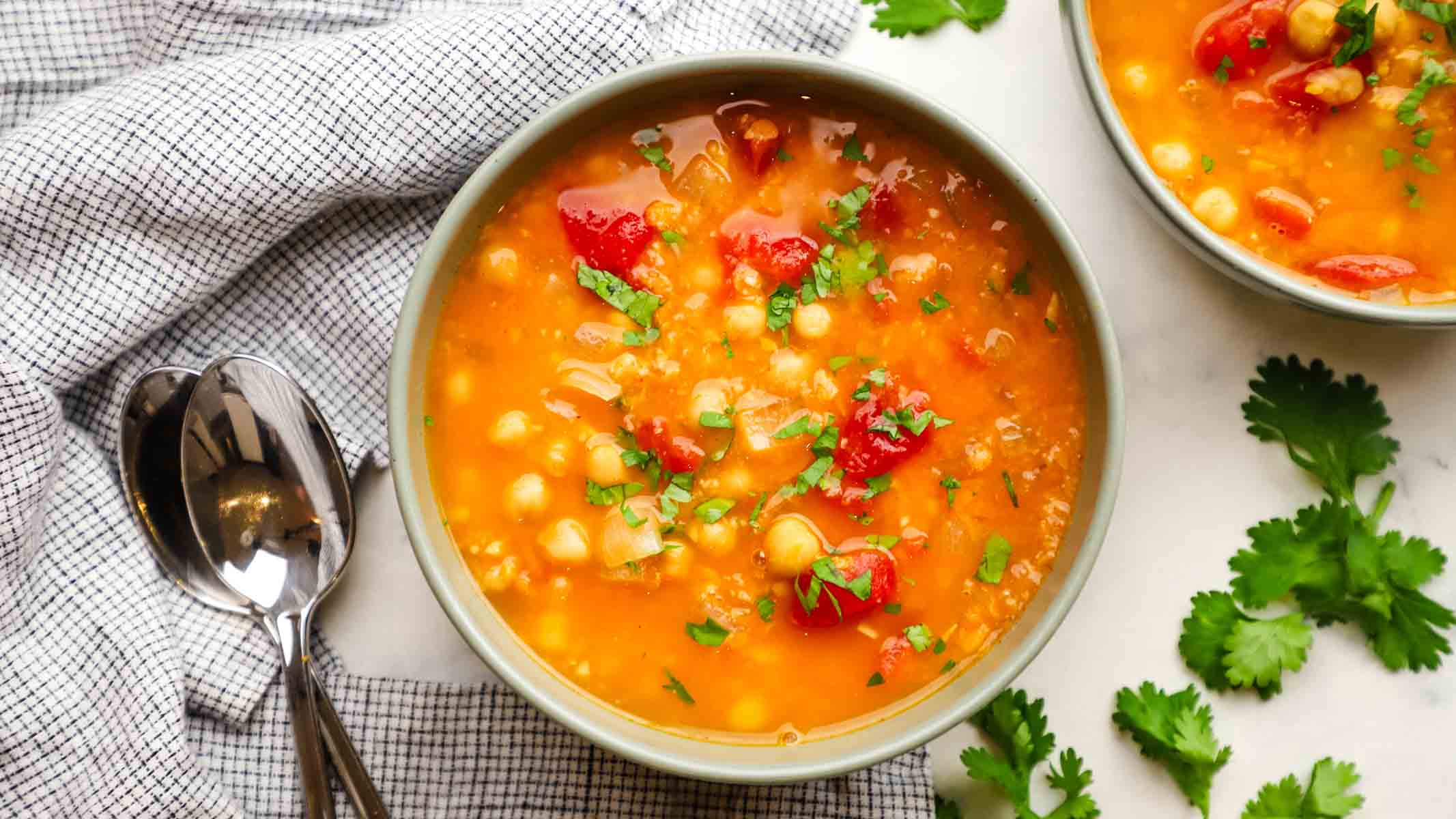 overhead view of a bowl of lentil and chickpea soup