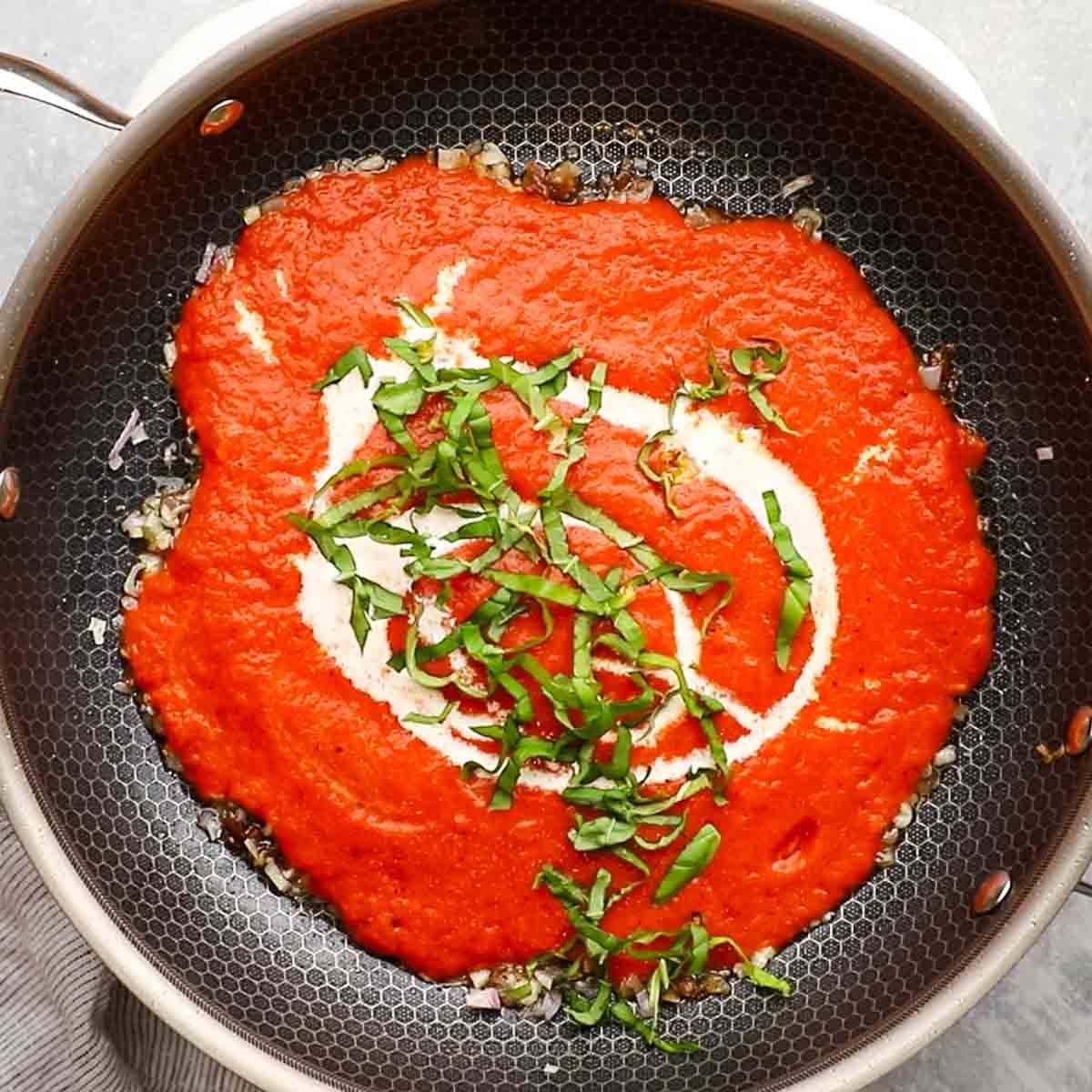 blended roasted red peppers and other ingredients added to the skillet