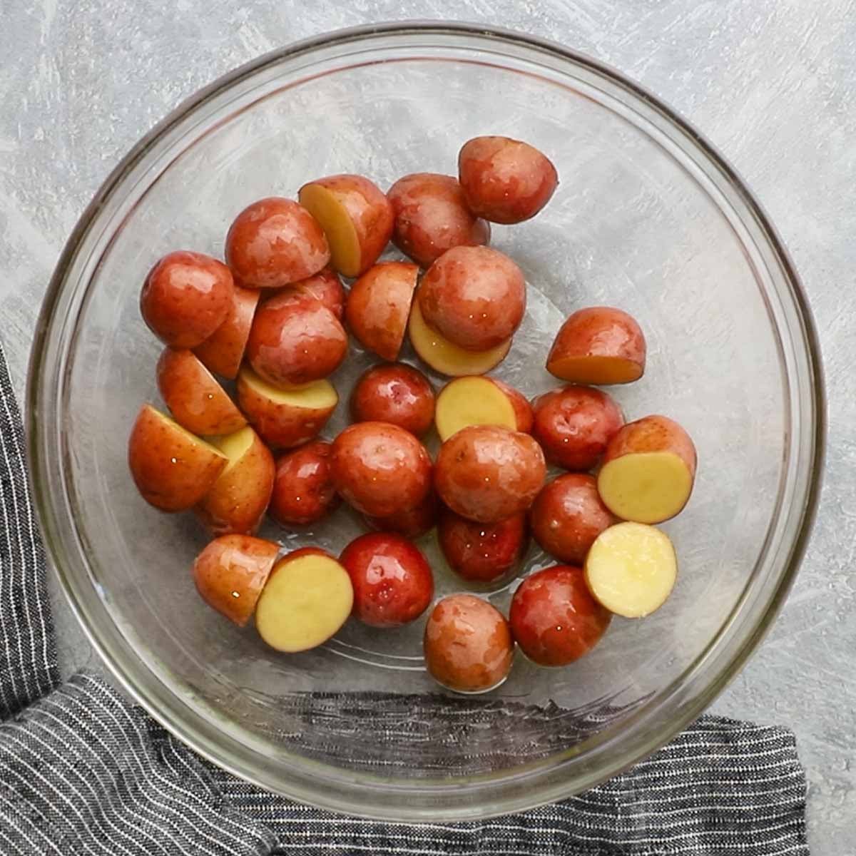 red baby potatoes tossed with olive oil