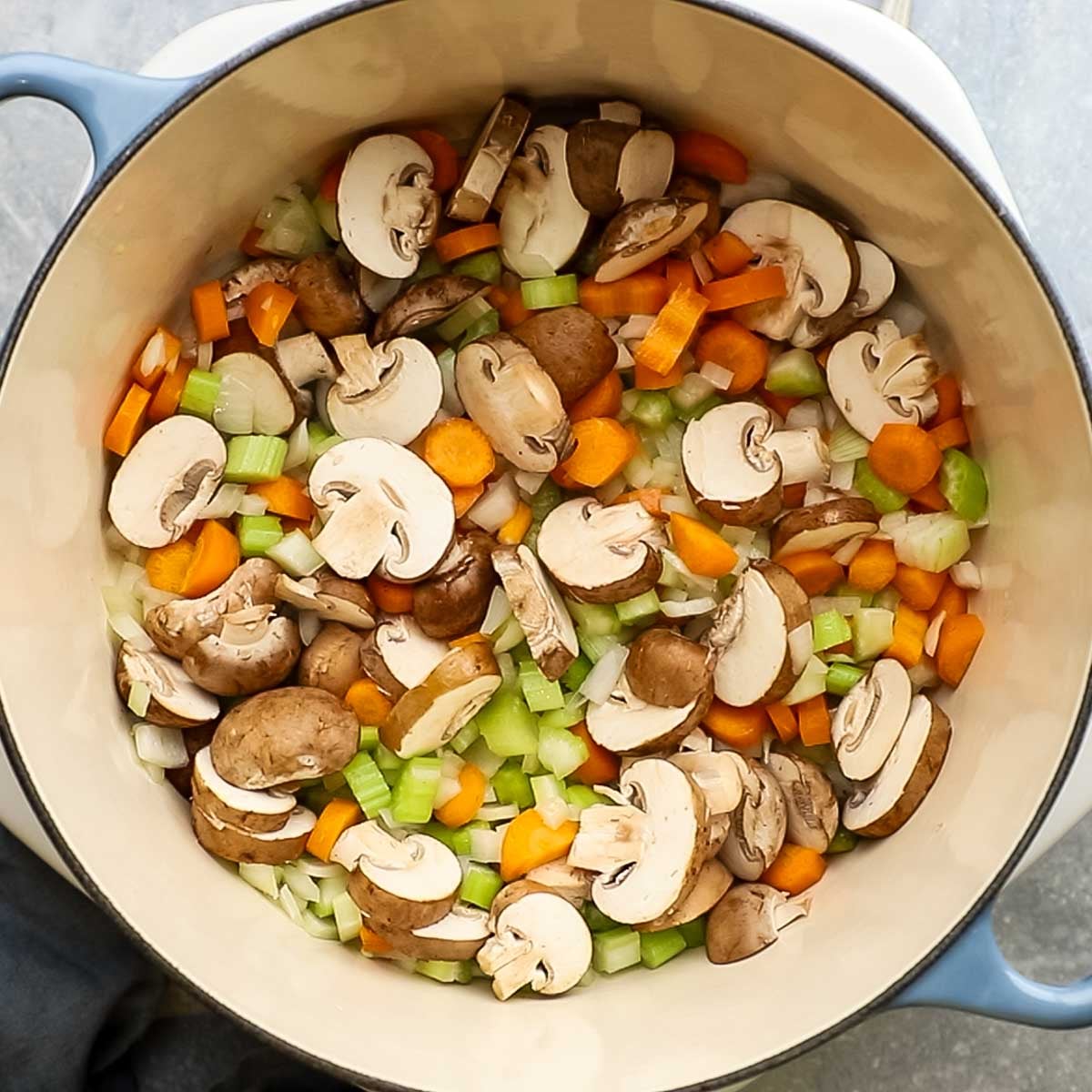 veggies added to the pot with olive oil