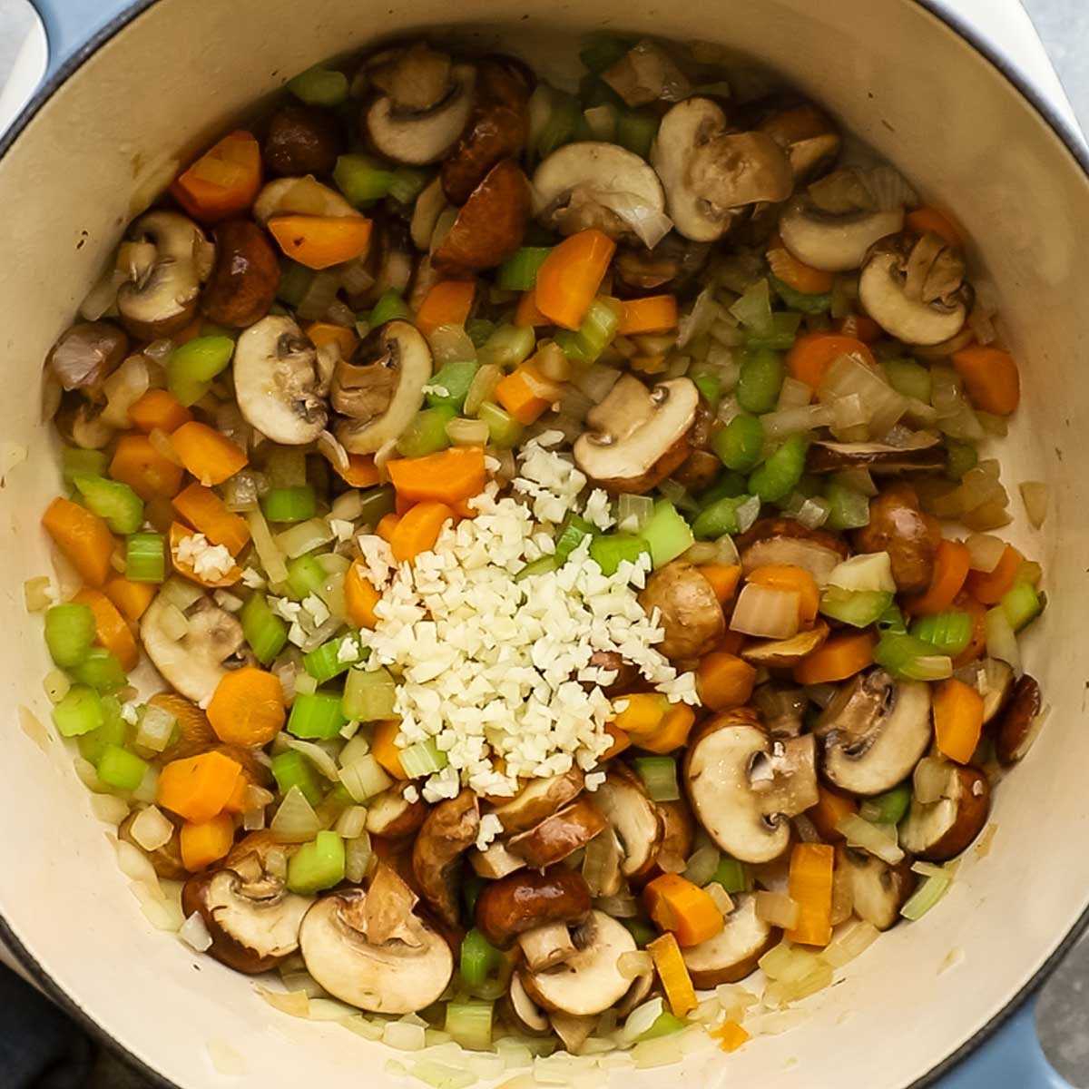 garlic added to the pot with the veggies