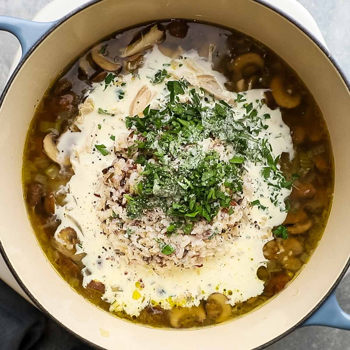 turkey, cream, and other ingredients added to the pot