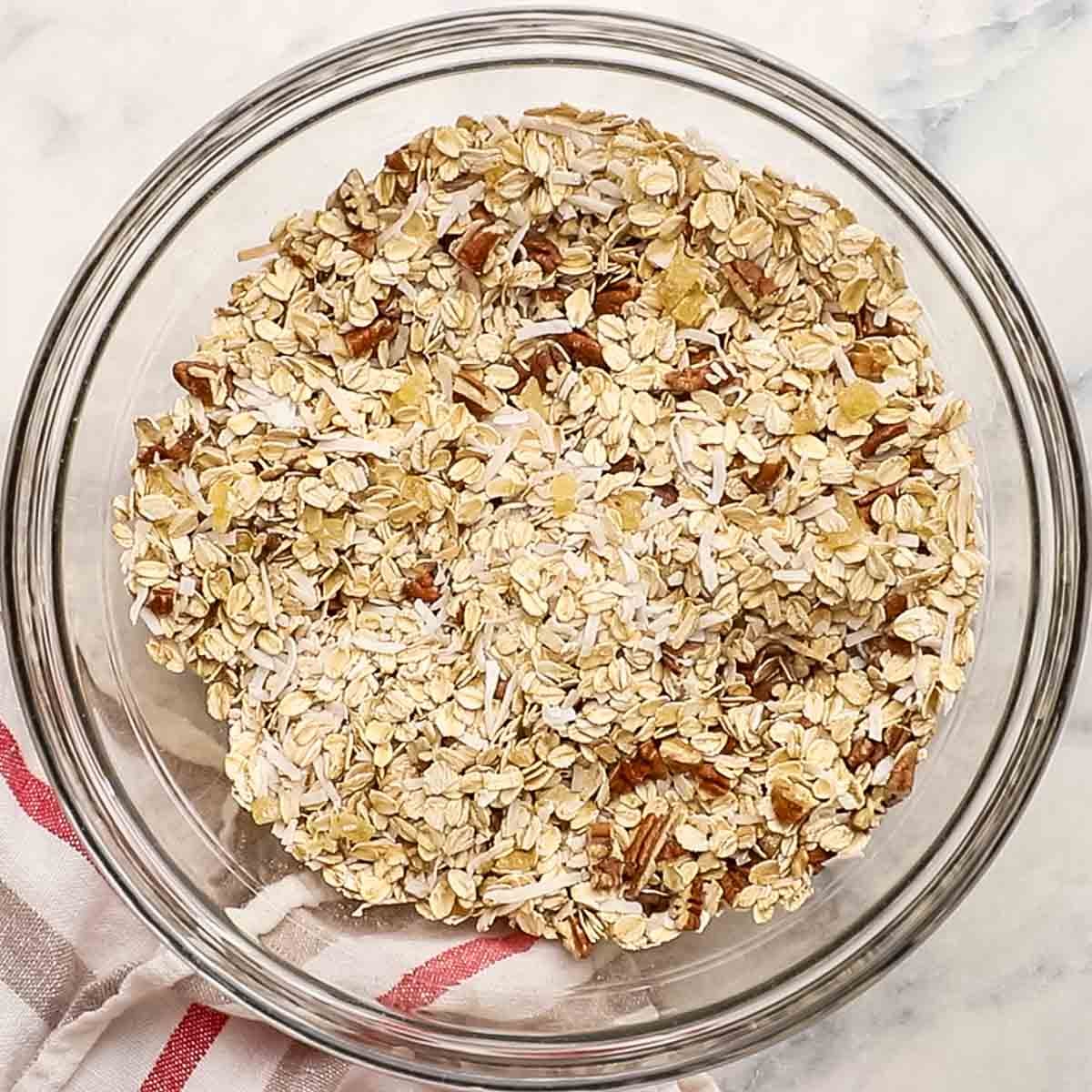 dry ingredients for gingerbread granola mixed together