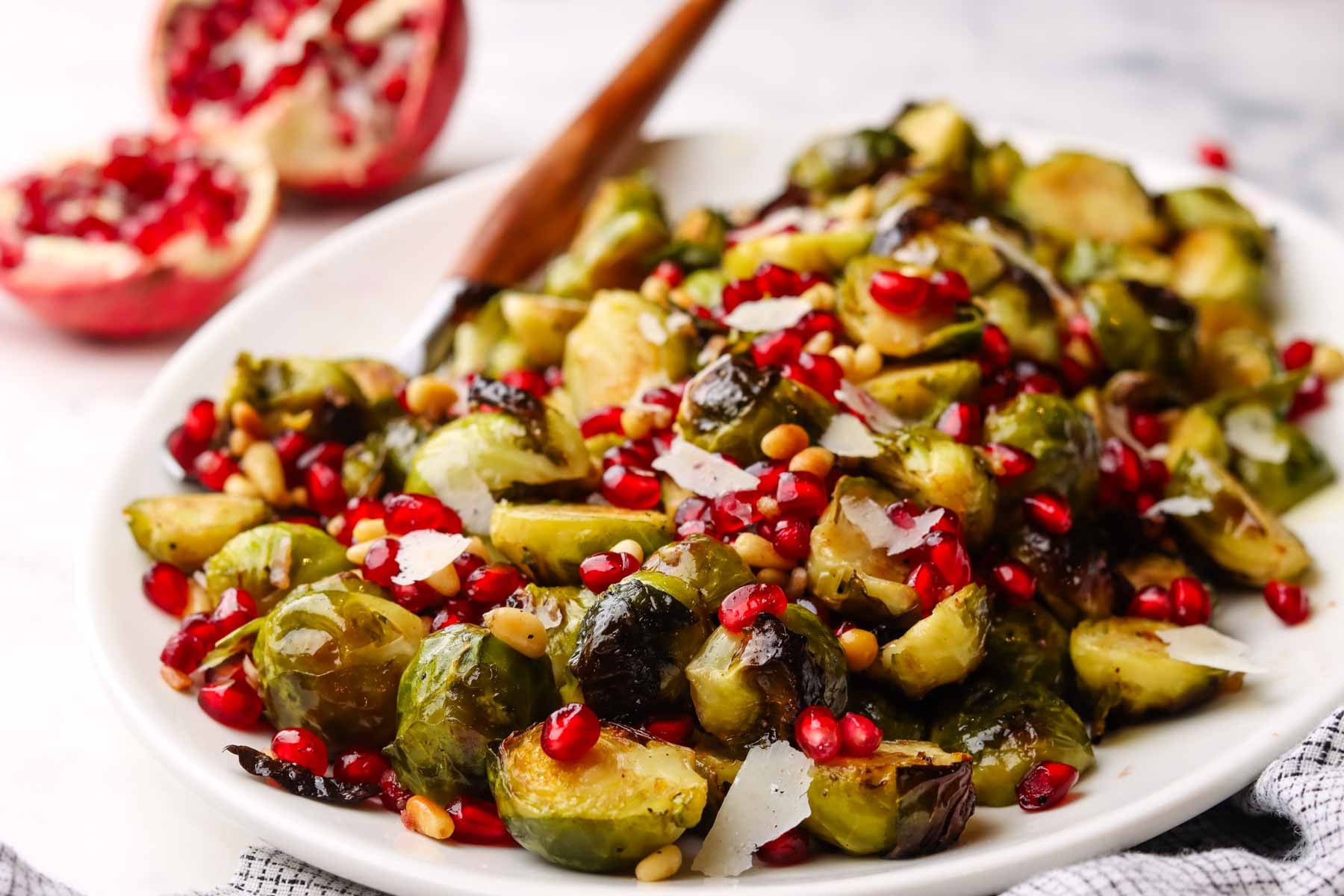 closeup of.a dish served with roasted Brussels sprouts with pomegranates