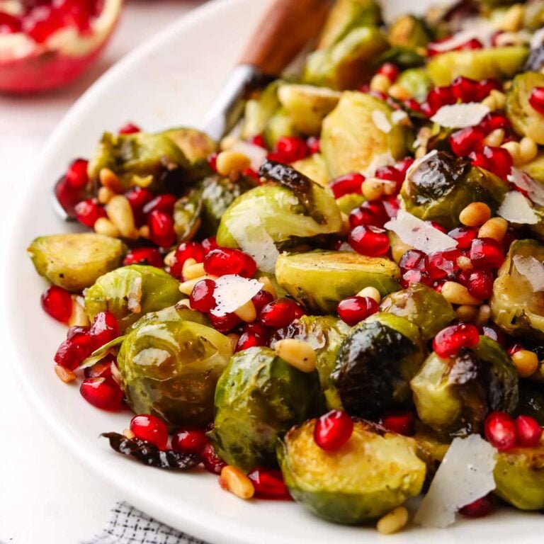 closeup of.a dish served with roasted Brussels sprouts with pomegranates
