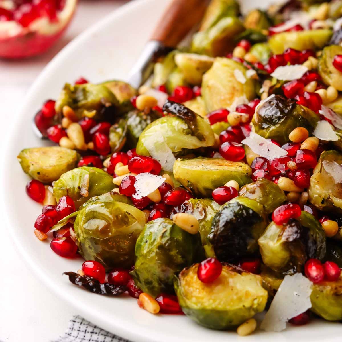 closeup of.a dish served with roasted Brussels sprouts with pomegranates