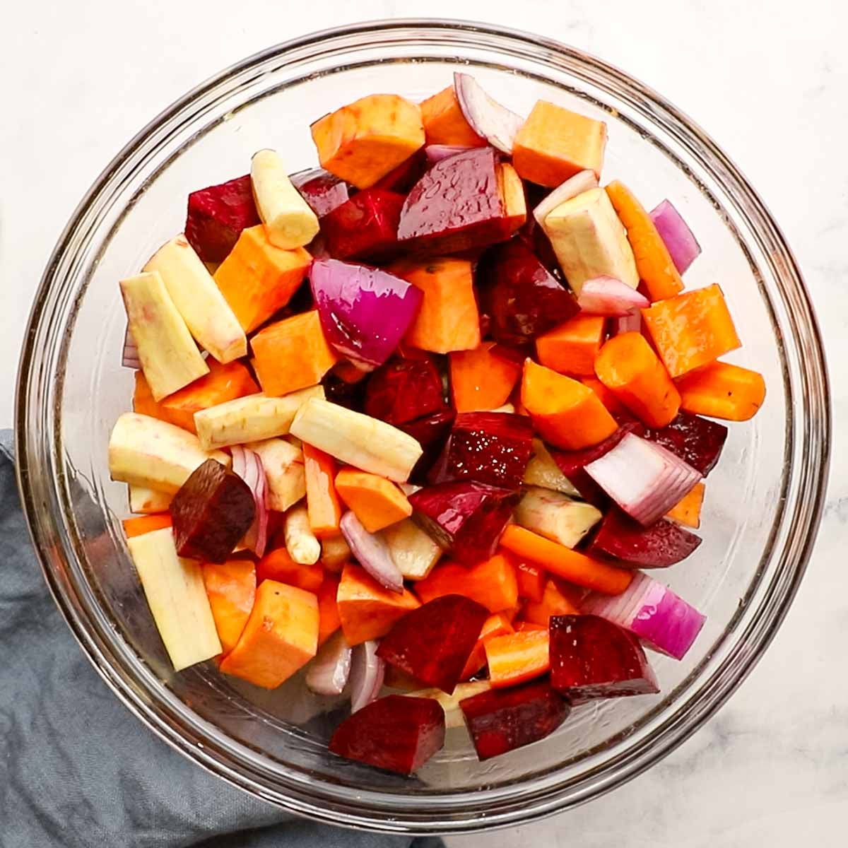 different root veggies cut up in a large bowl