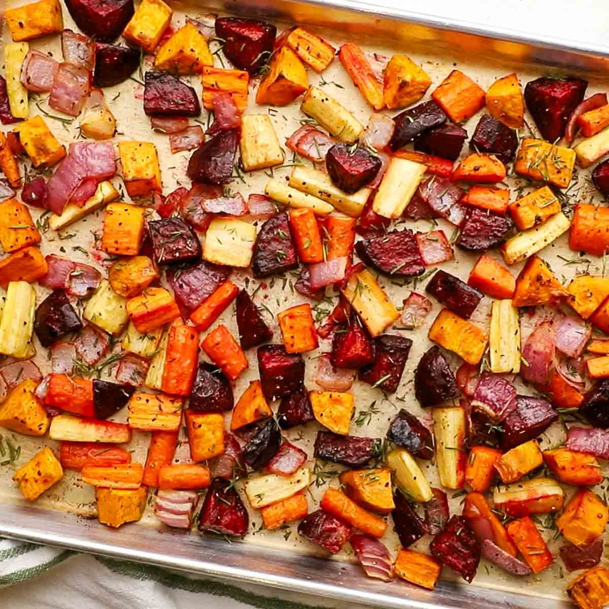 overhead view of roasted root veggies in a baking sheet