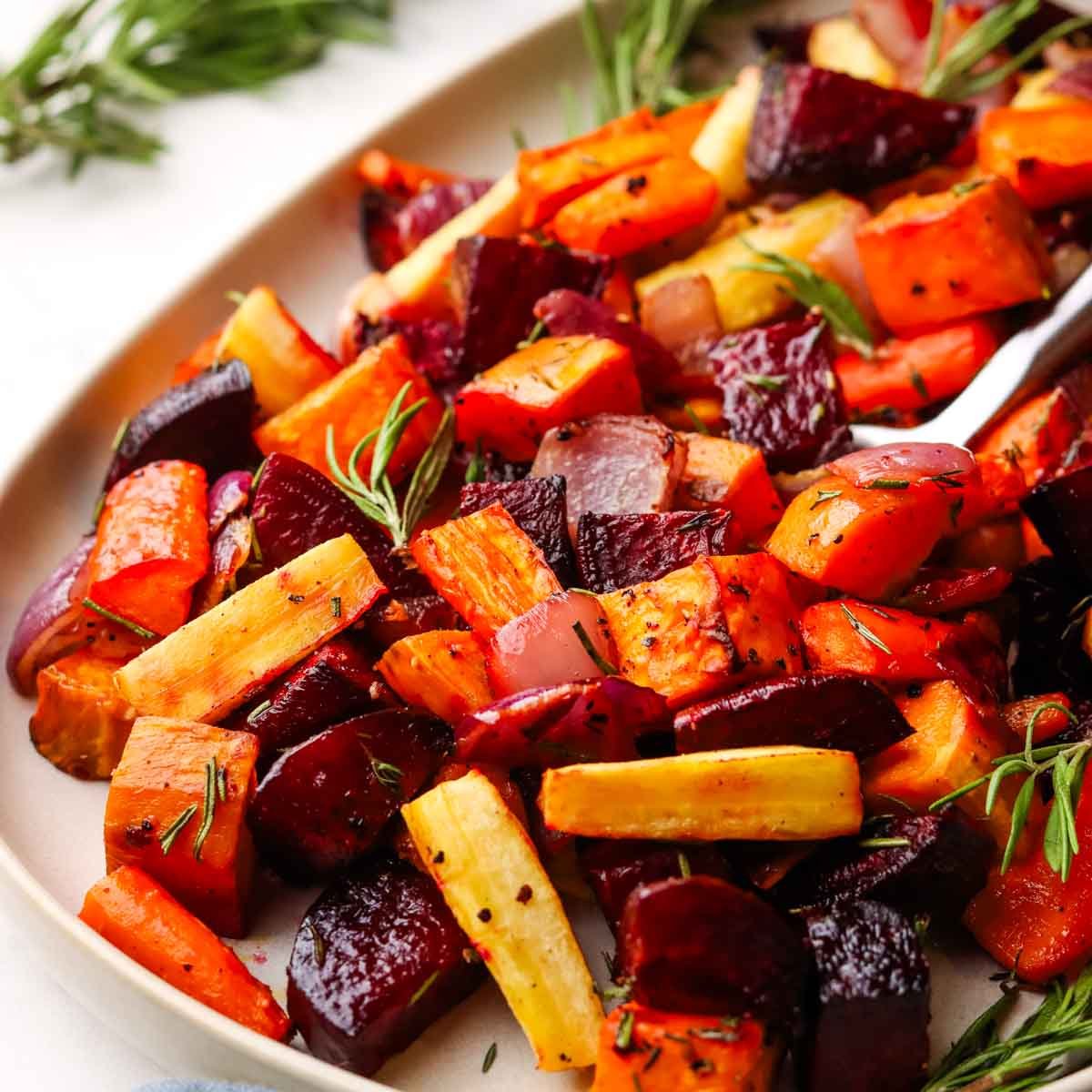 a serving dish with roasted root vegetables