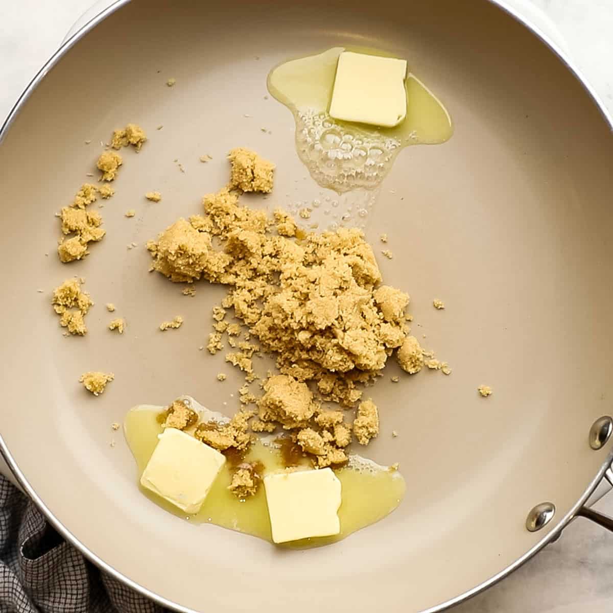 butter and brown sugar added to a pan