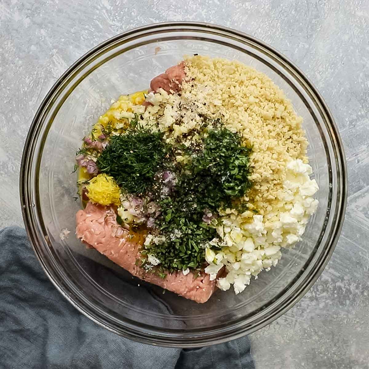all ingredients for meatballs added to a large bowl
