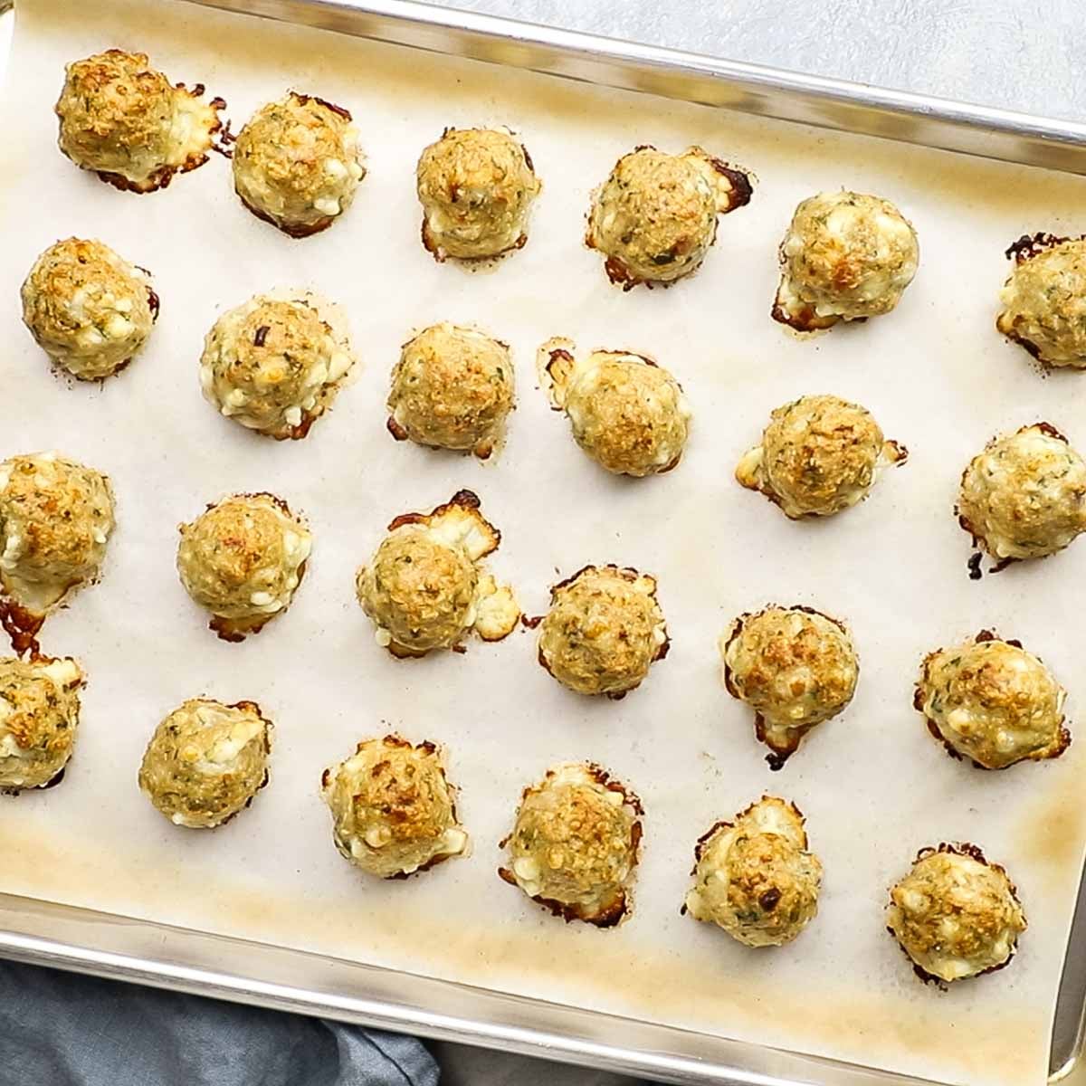baked meatballs on a baking sheet