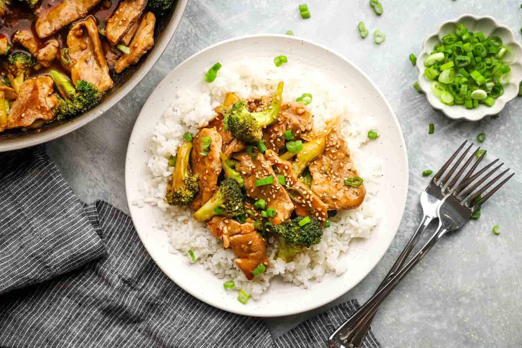 Broccoli and Pork, on top of white rice to make stir-fry, and ready to be served.