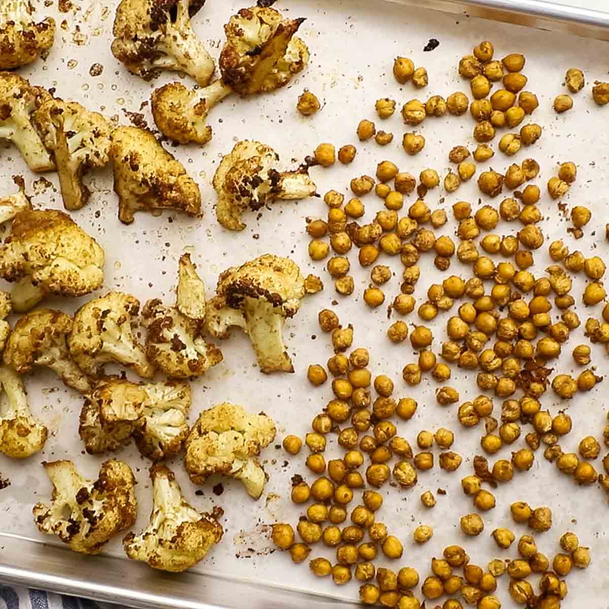 roasted chickpeas and cauliflower on a baking sheet