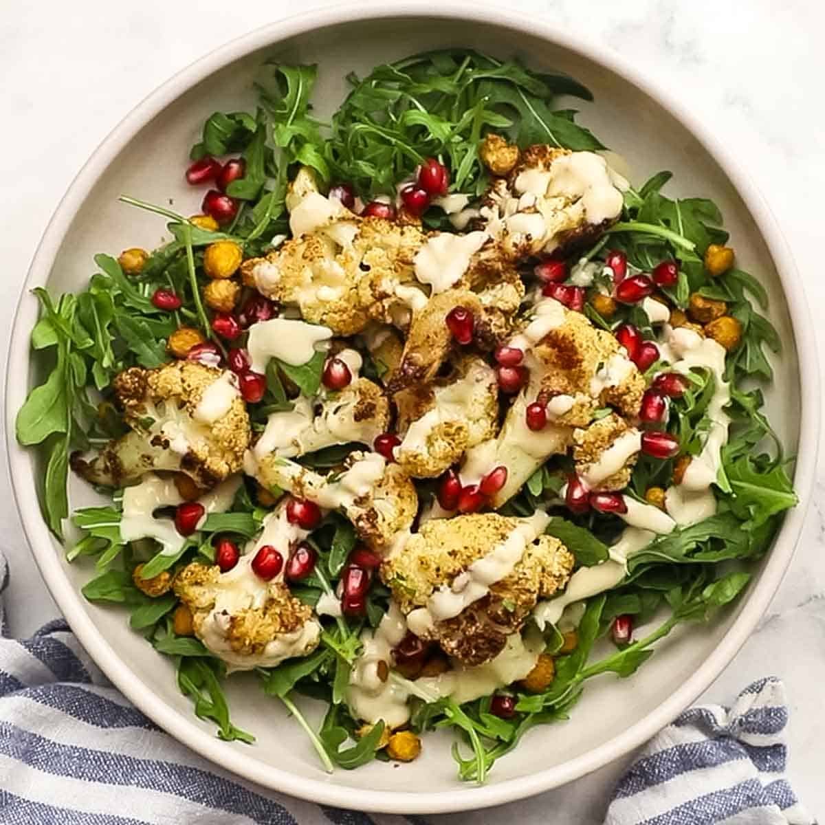 roasted cauliflower salad with lemon tahini dressing on a plate