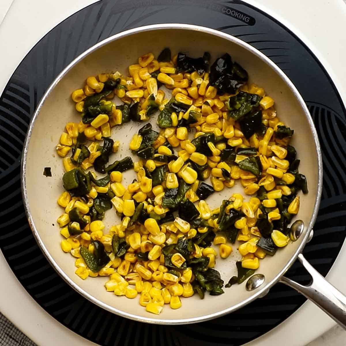 Poblano peppers that have been diced also added to the sauce pan with corn to be used as garnish.