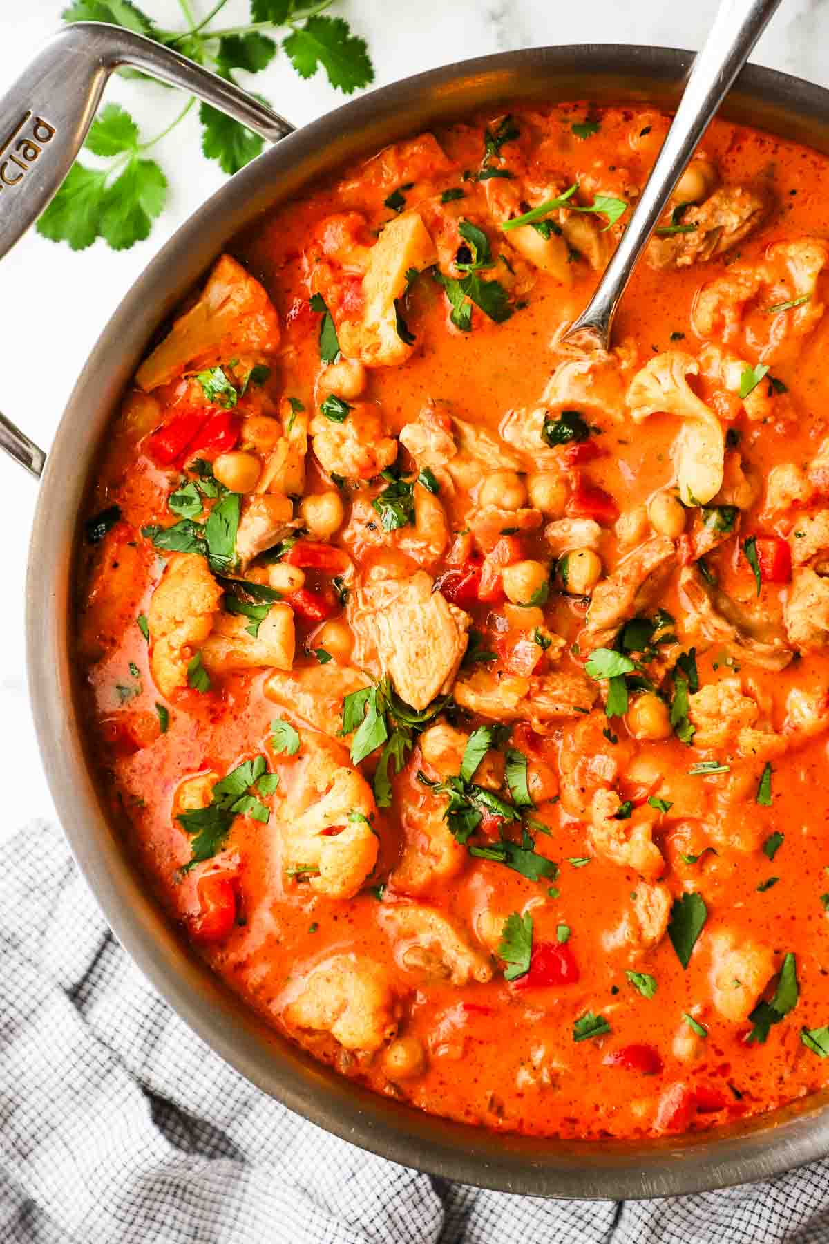 Closeup of a pan of chickpea chicken curry.