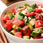 A bowl of cucumber watermelon salad.