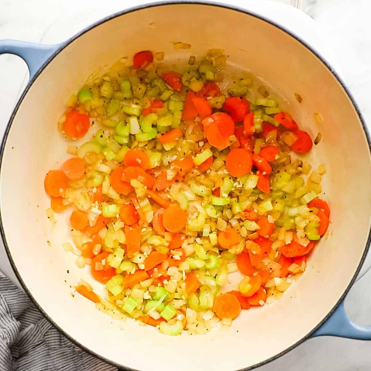 Carrots, celery, onions all together sauteing in a dutch oven for the soup.