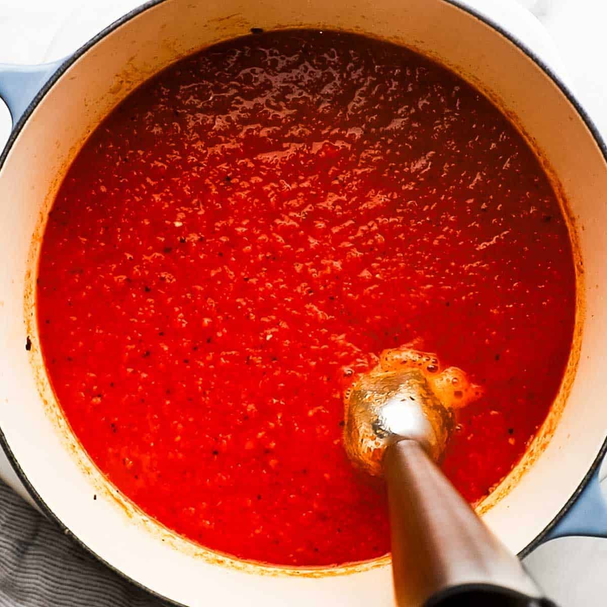 All the contents of inside the dutch oven gently mixed with an immersion blender inside the dutch oven.