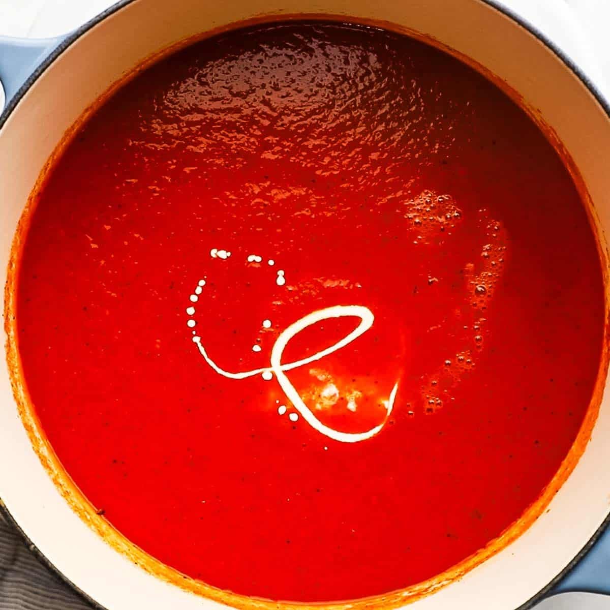 Heavy cream added to the vegetable and broth mix.