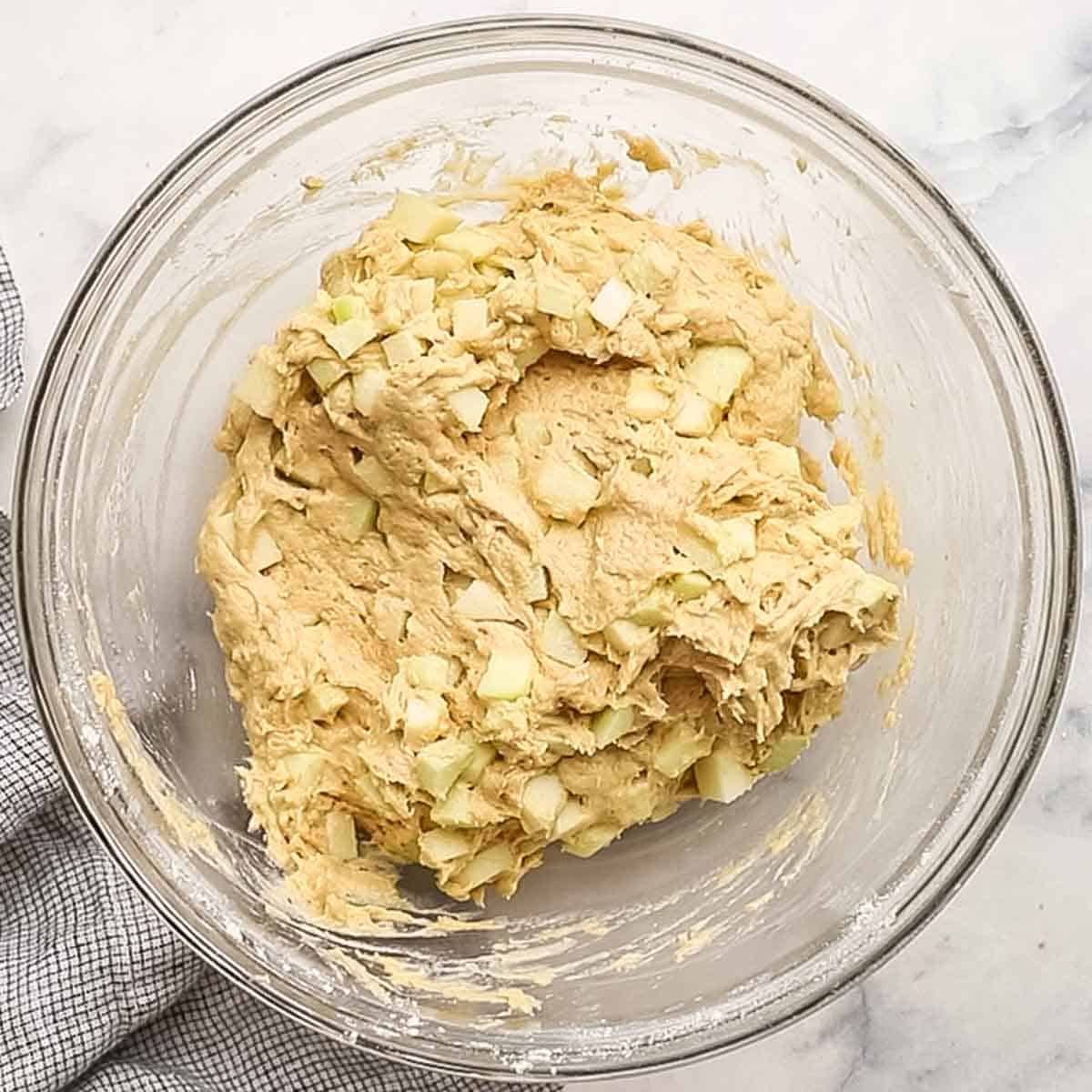apple sour cream muffin batter in a bowl