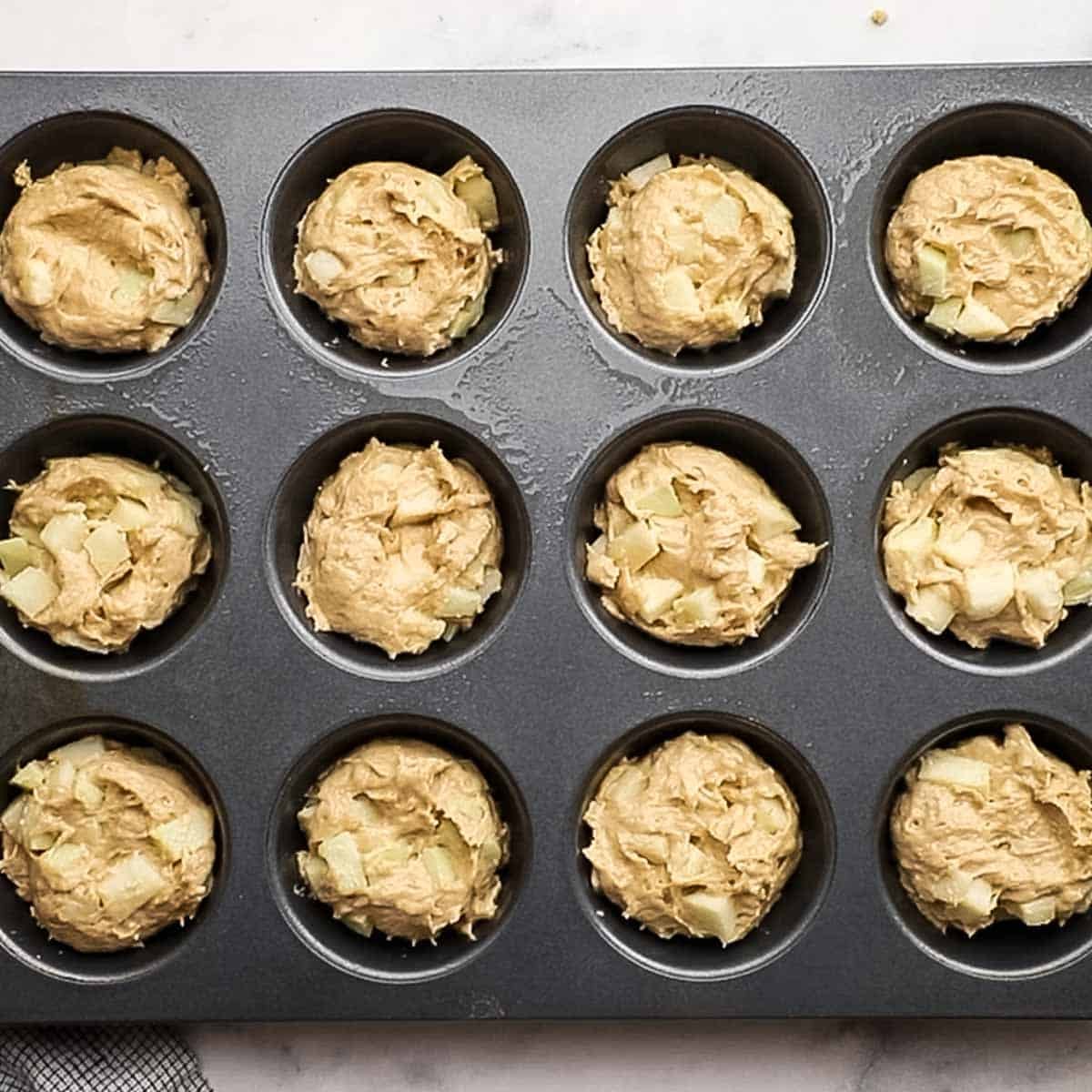 muffin batter divided equally in the muffin tray