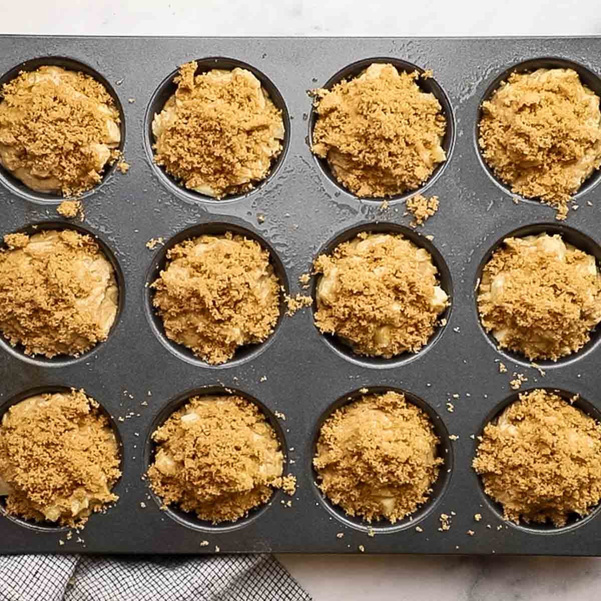 cinnamo sugar sprinkled on top of the muffins