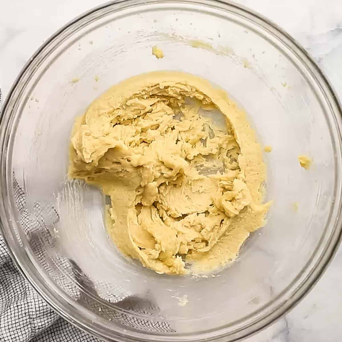 butter and sugars creamed together in a bowl