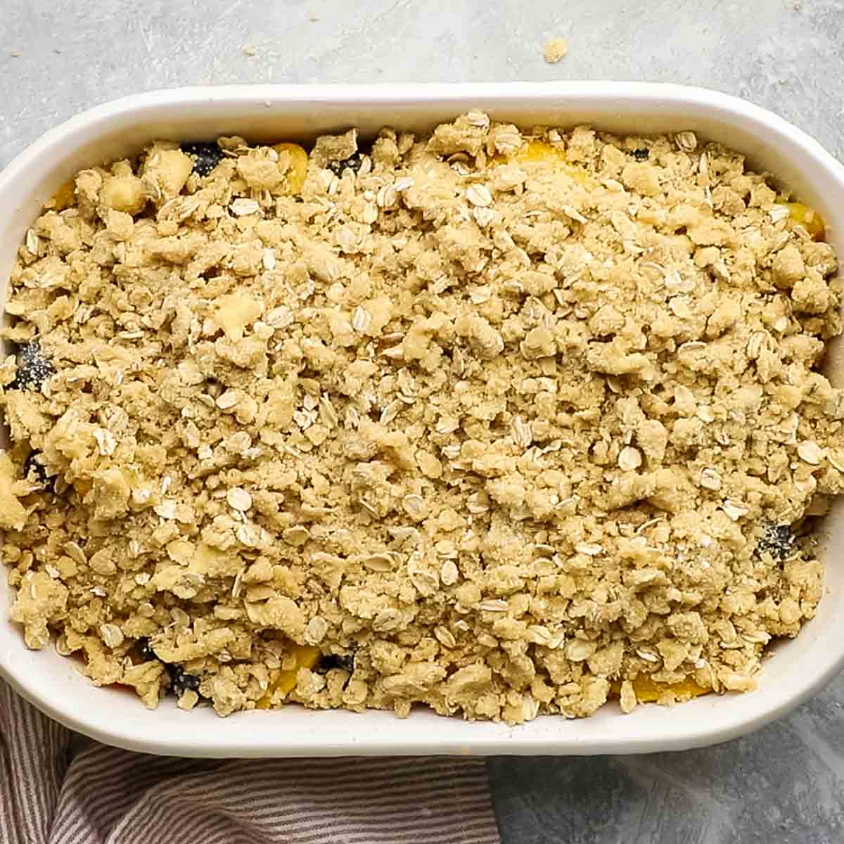 crmble mixture spread over the fruit