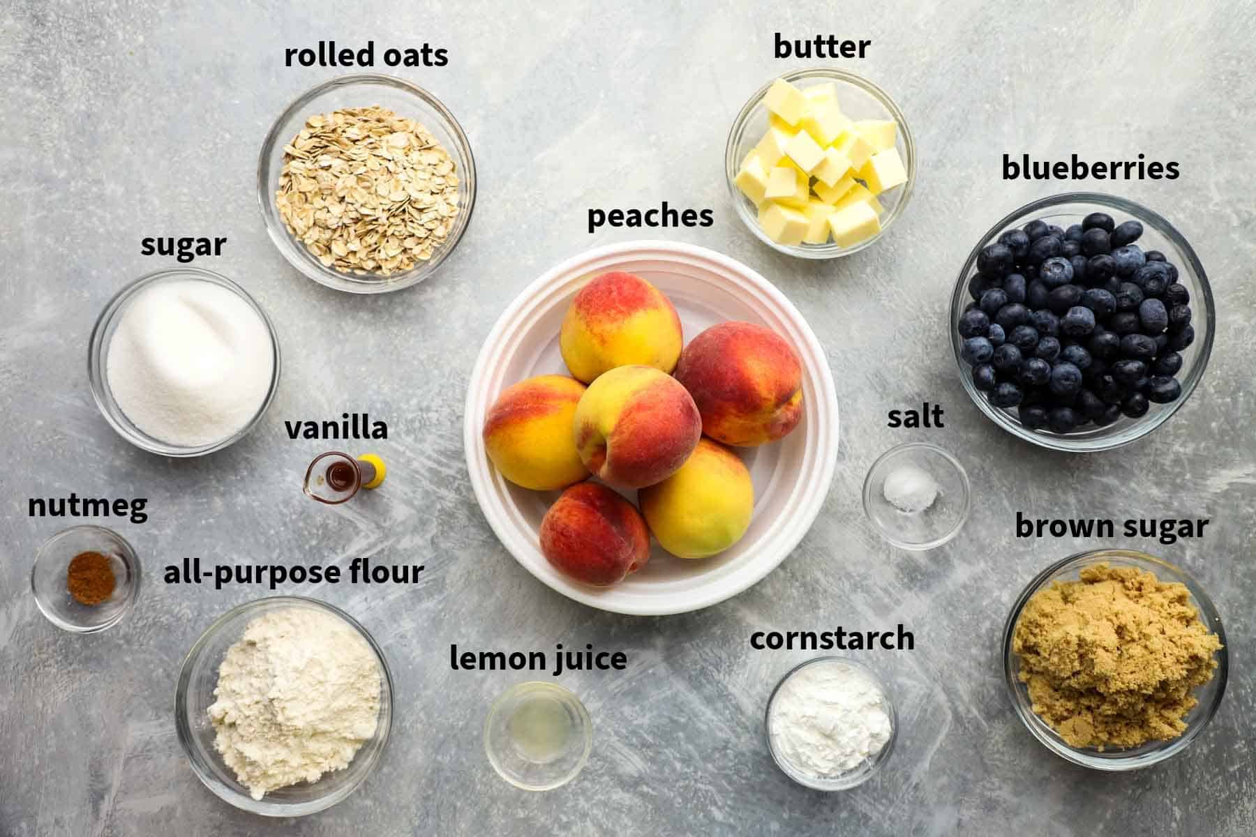 ingredients used to make peach blueberry crisp pictured and labelled.