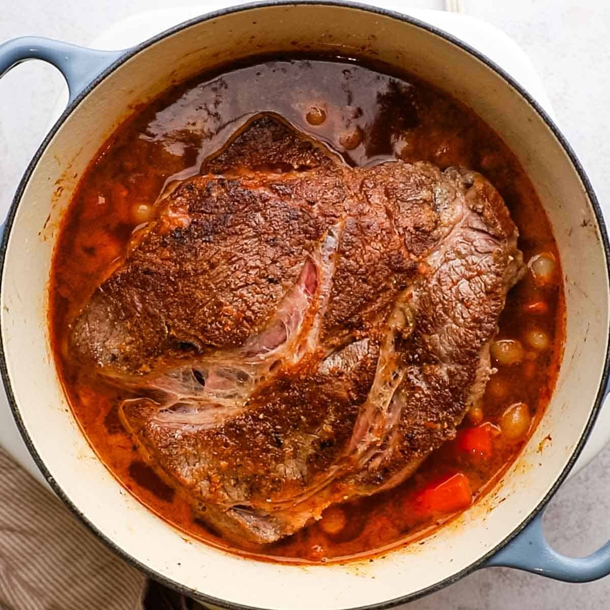 beef roast added to the pot